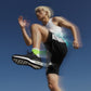 Person in athletic wear running against a blue sky (Green)