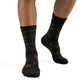 Black patterned socks worn on a white background (Beige)