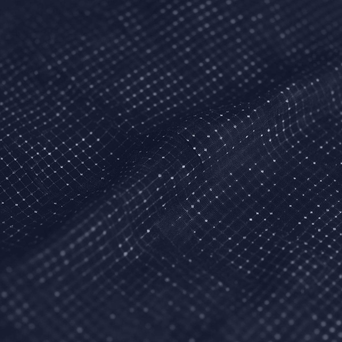 Close-up of a dark blue fabric texture with a subtle pattern (Blue)