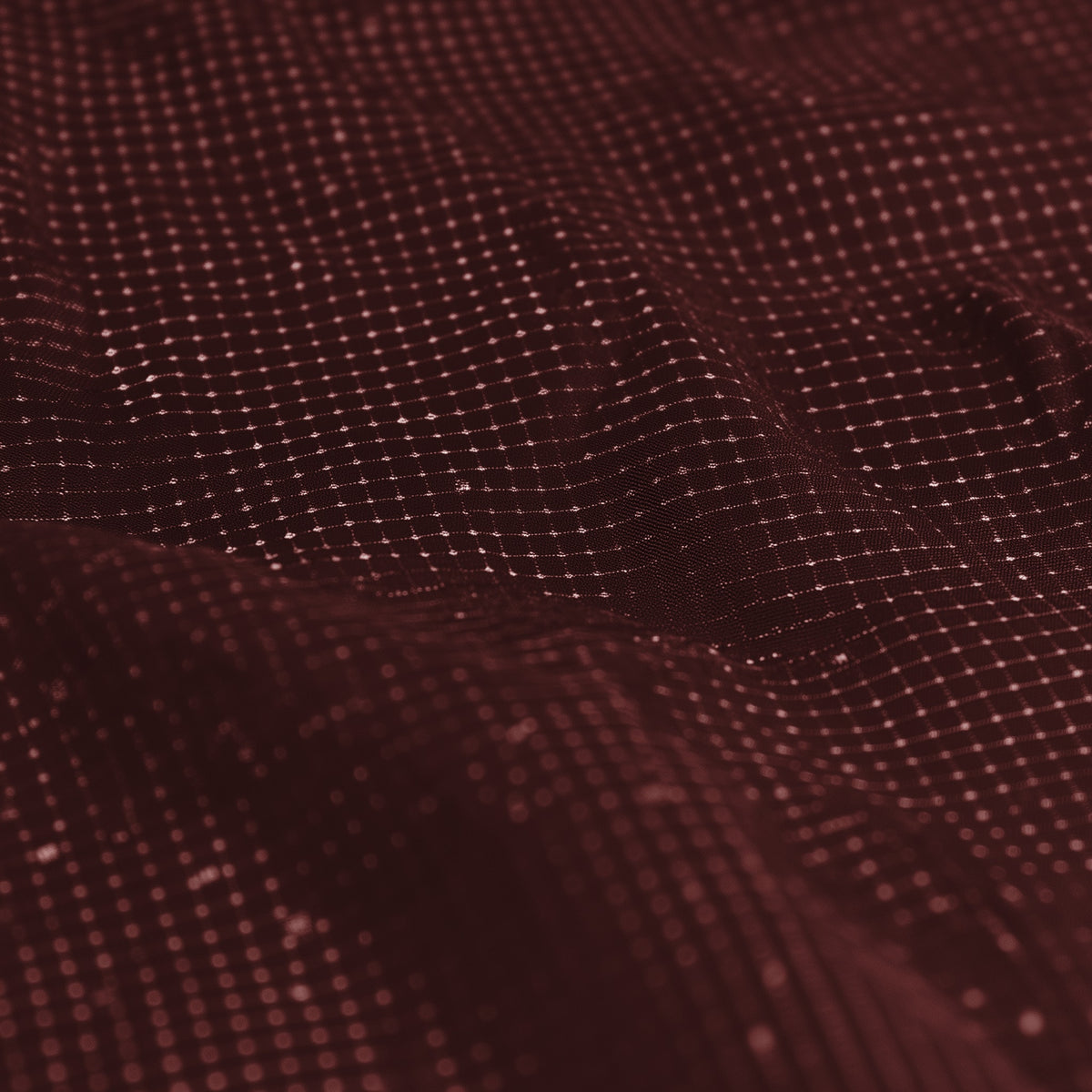 Close-up of a textured brown fabric surface (Red)