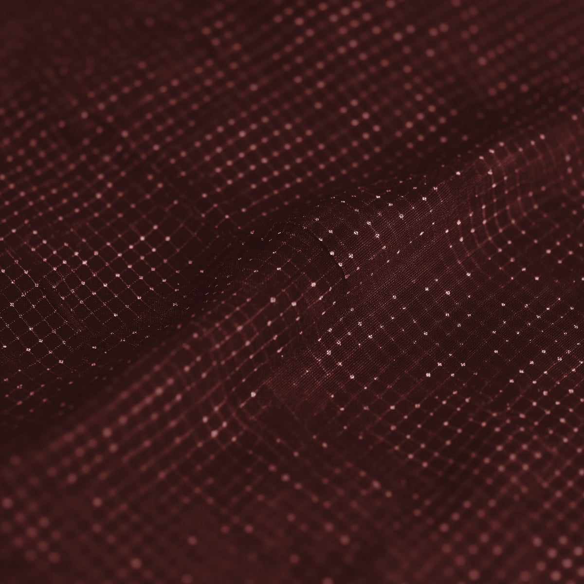 Close-up of a textured brown fabric surface (Red)