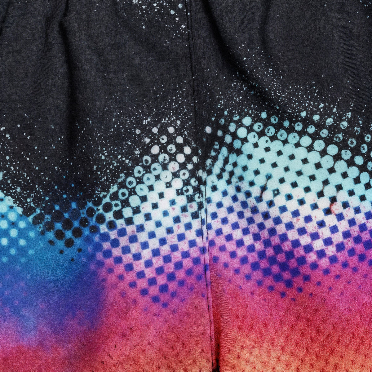 Close-up of a colorful gradient pattern on a textured surface (Black)