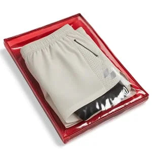 Men's performance shorts folded and sealed in retail packaging
