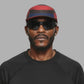 Multicolored cap with red, black, and blue design on a white background (Red)