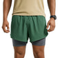 Green athletic shorts worn by a person on a white background (Green)