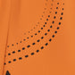 Close-up of an orange fabric with black geometric pattern (Orange)