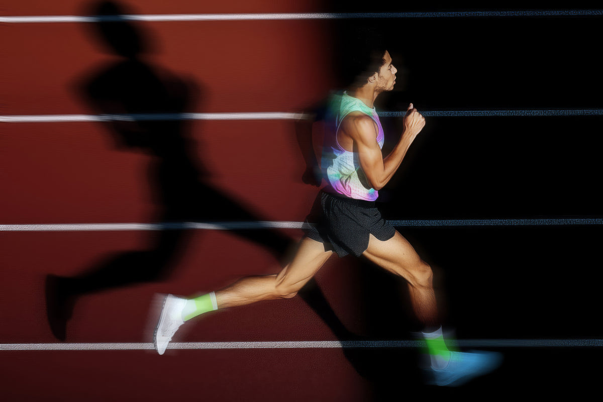 Athlete running on a track with a blurred background